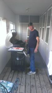 Grandpa grillin the burgers and dogs (no silly, hot dogs!)